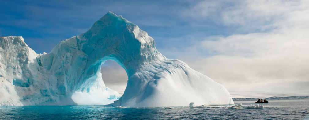 Silversea expedition cruise zodiak in front of Antarctica iceburg